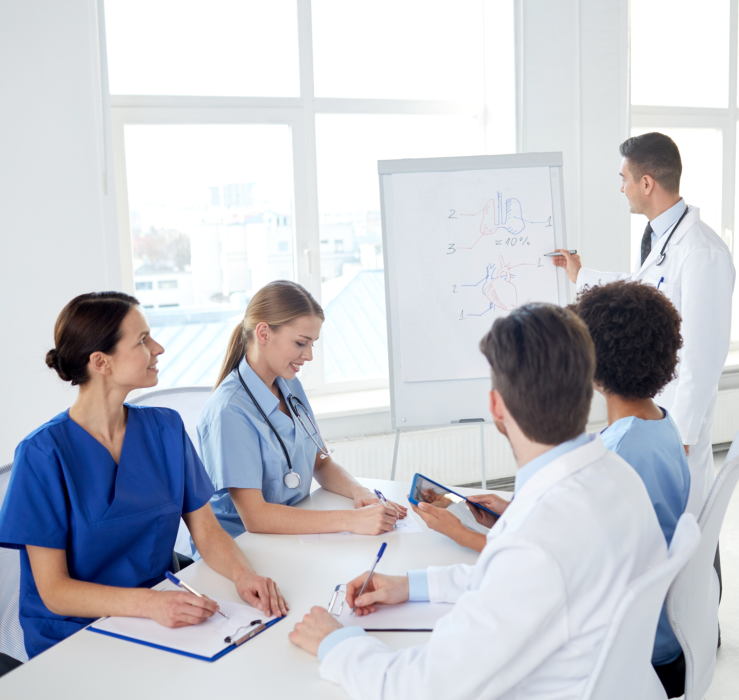 group of doctors and nurses having a meeting